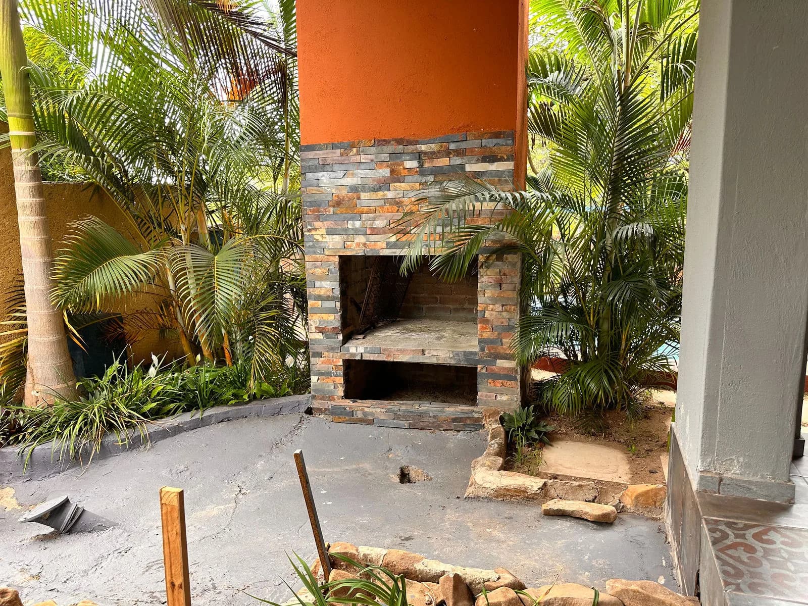 Stone-clad braai among the palms
